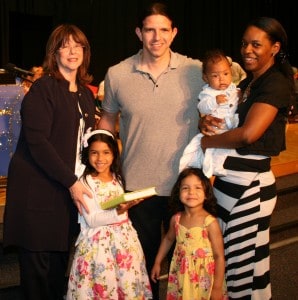 Ellie Debb (holding siddur) and family with Zena Herod, Head of School Ellie Debb (holding siddur) and family with Zena Herod, Head of School