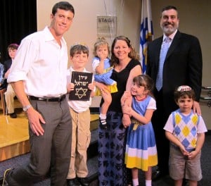 First grader Aiden Kempner (holding siddur) with his family an Rabbi Silver First grader Aiden Kempner (holding siddur) with his family an Rabbi Silver