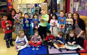Strelitz preschool four-year-olds show off their Shabbat dinner donations, along with teacher Elyssa Brinn and assistant Jacquie Lam. Strelitz preschool four-year-olds show off their Shabbat dinner donations, along with teacher Elyssa Brinn and assistant Jacquie Lam.