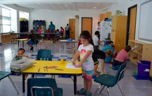 Kids Connection Post Camp JCC students enjoy the new Kids Connection space as staff members move in the last pieces of furniture and books and set up the computers.
