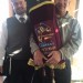 Kevin Lefcoe holds the Sefer Torah.