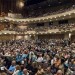 Audience members take their seats before the premiere. By the time the film began, the Sandler Center had reached its seating capacity, and reported a standing room only crowd of more than 1350.