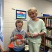 Nancy Brickell (right) receives gift from a BEAR student at Birdneck Elementary.