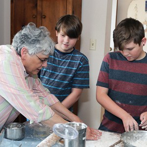 Sheryl Luebke and twins John and Peyton Rchardsonprepare the dough for Hamantashen. Sheryl Luebke and twins John and Peyton Rchardsonprepare the dough for Hamantashen.