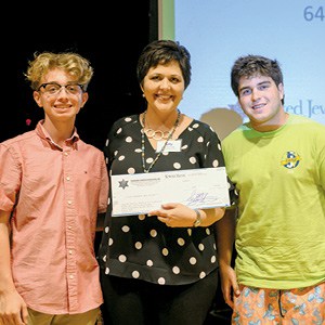 Danial Watts and Zach Sissel of the Emerging Philanthropists Council present a check for $500 to Kelly Burroughs, JFS CEO. Danial Watts and Zach Sissel of the Emerging Philanthropists Council present a check for $500 to Kelly Burroughs, JFS CEO.